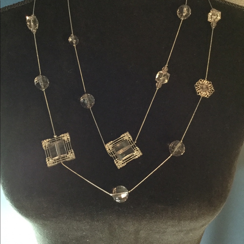 Long necklace with pretty beads and medallions.